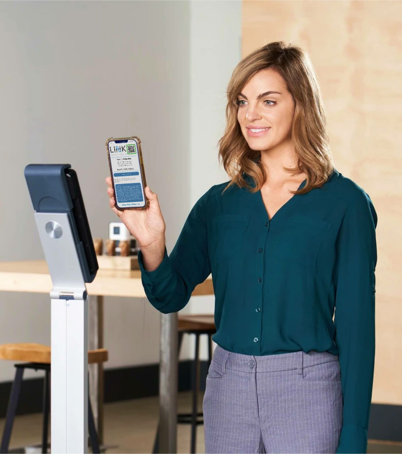 Woman scanning her phone with LINK displayed
